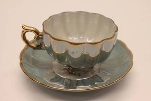 lot 126 image: Vintage Royal Sealy China Gold-footed Opalescent Cup and Saucer