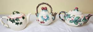 lot 27 image: Set of 3 Teapots- Otagirl Mary Ann Baker Ivy Teapot, The Haldon Group Porcelain BlackberryRaspberry  Basket Weave Teapot and Unbranded Cherry Weave Teapot