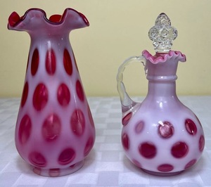 lot 64 image: Fenton Cranberry Opalescent Coin Dot Pattern 7.5 Ruffled Vase and Fenton Cranberry Coin Dot 7 Cruet