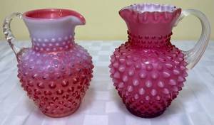 lot 86 image: Fenton Cranberry 6 Hobnail Glass Pitcher with Crimped Rim and Fenton Cranberry  Opalescent Hobnail 5.75 Jug