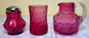 lot 75 image: Fenton Cranberry Glass Coin Dot 4.5 Tumbler, Coin Dot Optic 5 Pitcher and Coin Dot Optic Thumbprint Sugar Shaker