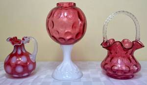 lot 72 image: Fenton Art Glass Cranberry Coin Dot Spot Basket with Crystal Handle, 5 Glass Creamer with Ruffled Rim and Cranberry Dot Optic with Milk Glass Base Vase