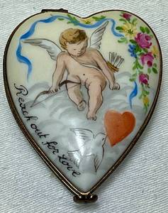 lot 121 image: Limoges Heart Box Reach Out for Love Trinket Box with Cupid