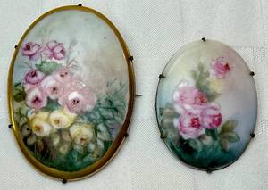 lot 138 image: Hand Painted Porcelain Antique Victorian Floral Brooches 2.5 and 2. Large one reads G.M. Lloyd Charles City, Iowa on back.
