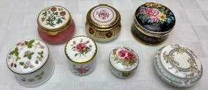 lot 135 image: Seven Porcelain Trinket Boxes, Made In England, Coalport, Wedgewood, Straffordshire Enamels, Royal Worcester and Avondale