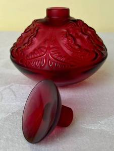 lot 191 image: Lalique Psyche Crystal Perfume Bottle with Stopper Cranberry Red with four faces and leaf motif.