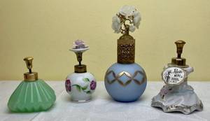 lot 196 image: Vintage Irice Perfume Bottles - I W Rice & Co. - Glass Opaque Perfume Bottle Gold Overlay with Crystal Flower Center, Jadeite with Gold Top and two Porcelain Perfume Bottles