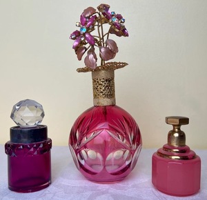 lot 203 image: Vintage Cut Glass Pink Perfume Bottle with Gold Topper,  Volupte Vintage Perfume Bottle and Vintage Cranberry Crystal cut Perfume Bottle