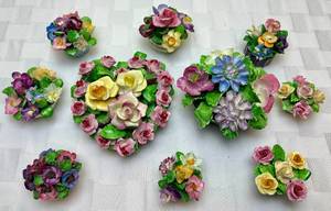 lot 179 image: Coalport Bone China Floral Bouquets - Made in England-  7 Mini Flower Pots, One White Pot Flower Bouquet, One Black Heart Pot Bouquet and One Black Pedestal Bouquet
