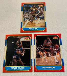 lot 37F image: 1986 Fleer Basketball 3 Card Lot - Gerald Wilkins #122, Jay Humphries #49, Eric Floyd #34
