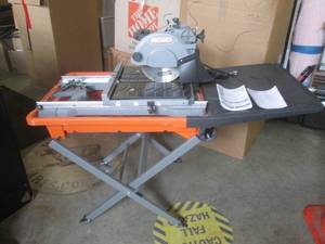 lot 5 image: (EC1) Ridgid R4040 8 Tile and Paver Saw with Laser and Adjustable Stand - Looks Unused