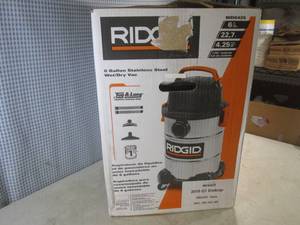 lot 7 image: (CSB) Rigid 6 Gallon Stainless Steel WetDry Vac with Accessories - Open Box But Marked Complete and Works - I Plugged It In And Works Looks Unused