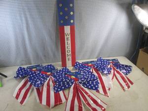lot 150 image: (F-0) Wood Patriotic Welcome Sign with Shotgun Shell Design 22 34 x 5 14 and 5 RWB Bows