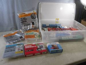 lot 160 image: (F-2) Assorted Caulking, Caulk Guns and Weather Stripping In Tote with Lid