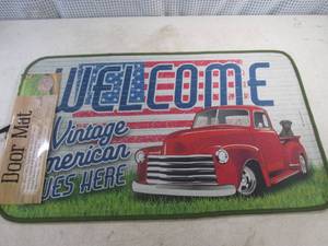 lot 185 image: (B-2) Welcome A Vintage American Lives Here Door Mat IndoorOutdoor 30 x 17.7 - New