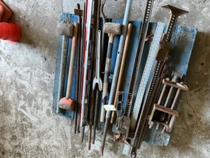 Lot of tools -  3 Mauls, 2 Handy man Jacks. Wood Vice, 6 Pry Bars, Levels, Wood Vise