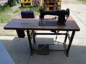 Singer industrial sewing machine. Think from the late 1950s. Been sitting a while. Good working unit. As shown.