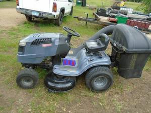 Craftsman 1500 series manual shift riding mower. Paint has been touched up. Tested & works. As shown.
