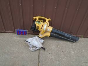 Yard Machine blowervac. Used condition. Fires on ether. As shown.