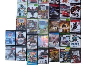 lot 152 image: Ultimate Gaming Bundle Guitar Controllers, Games, and Accessories