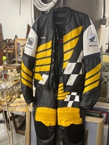 lot 157 image: VINTAGE HONDA RACING LEATHER MOTORCYCLE JACKETPANTS & SHOES SET