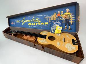 lot 18 image: Vintage Gene Autry Guitar in Box