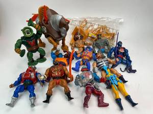 lot 28 image: Masters of the Universe Figure Lot with Stridor and Castle Grayskull Playset Parts