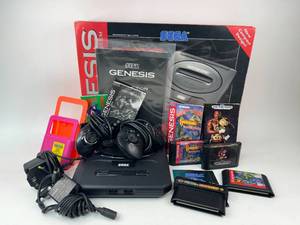 lot 63 image: Sega Genesis Video Game System with Games