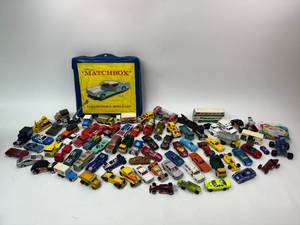 lot 65 image: Vintage Hotwheels, Matchbox, Tomica, Micro Machines, Misc. Car Truck Lot with Carrying Case