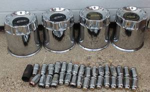 lot 10 image: 4 Wheels & Tires LT 325  50 R 22  121 S Kumho Brand 8 Bolts Pattern Comes With Original Hub Caps, Original Bolts And theft Protection Bolts