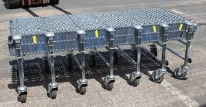 lot 21 image: Extendable Flex Skate Wheel Gravity Conveyor  24 Inch X 20 Ft