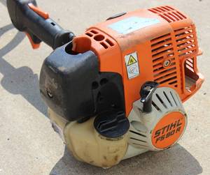 lot 30 image: STIHL Model # FS 90 R, Gas Powered Straight Shaft Professional String Trimmer