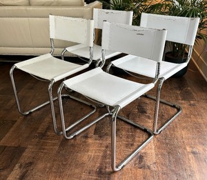 lot 32 image: Four Cantilever Dining Chairs