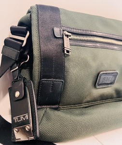 lot 75 image: Tumi Bag Personalized Monogramed in Olive in Color and Orange Inside