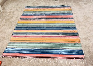 lot 61 image: Vintage Malibu Stripe Indoor  Outdoor Rug Sunscape with White Tassels
