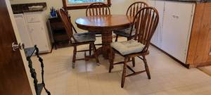 lot 16 image: Dark Oak Pedestal Dining Table Set  Table  4 Chairs  Leaf