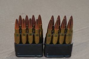 lot 114 image: 2 Cartridges with .30-06 Sprg FMJ Rounds