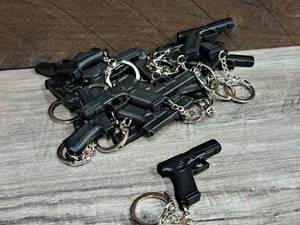 lot 249 image: Lot of (17) Hand Gun Keychains
