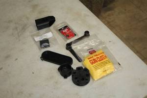 lot 315 image: Lot of (10) Misc. Gun Accessories - Hoppes 9 Wax Treated Gun Cloth, Carbon Express True Vision Magnum Peep 732, Grip Insert and more