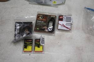 lot 324 image: Lot of (5) Assorted Archery Accessories - Kisser Button, Crossbow Accessory, Mossy Oak Release Aid String Loop, and more