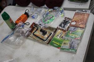 lot 326 image: Lot of (13) Misc. Outdoorsman Accessories - Ponchos, Can Opener, Scrape Bomb, Fresh Earth, Earplugs and more