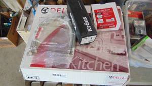 lot 217 image: New Delta Faucet with other Plumbing Stuff