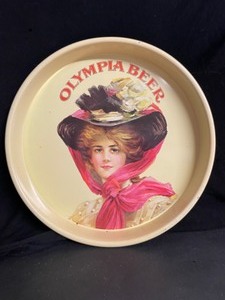lot 131 image: Olympia Brewing Co. beer tray, 1909 girl in hat