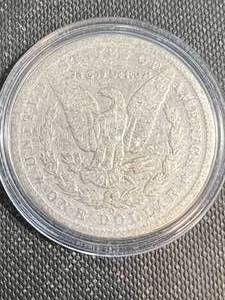 1887-O US MORGAN SILVER DOLLAR IN AIRTITE