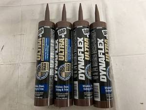 lot 41 image: 4 Bottles of Brown Dynaflex Ultra Window, Door, Siding and Trim
