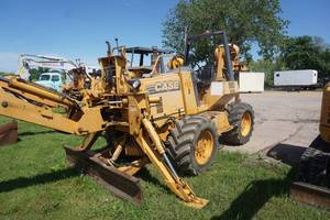 lot 10 image: Case Model 860 Turbo 4 x 4 x 4 Cable Plow Back Hoe