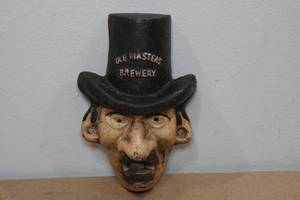 lot 53 image: Vintage Ole Masters Cast Iron Wall Bottle Opener