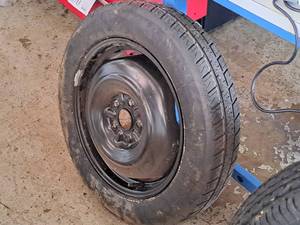 lot 710 image: Firestone T15580R17 101M LL Temporary Spare Tire with 5-Lug Rim