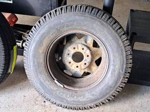 lot 716 image: Goodyear Wrangler LT24575R16 Tire with 7-Lug Rim