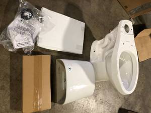 Glacier Bay 12 inch Rough In Two-Piece 1.1 GPF1.6 GPF Dual Flush Elongated Toilet in White Seat Included  Customer Returns See Pictures